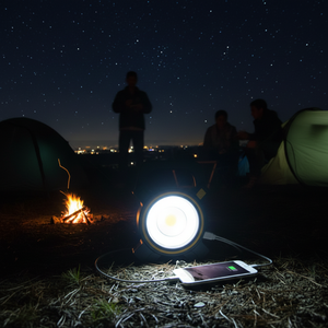 COB lantern charging phone via USB in dark outdoor setting – power bank function