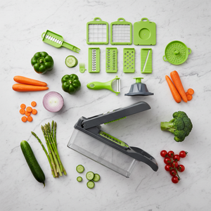 Flat lay of vegetable cutter with all blades and fresh vegetables on marble surface
