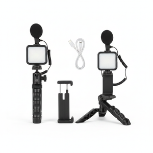 Vlogging kit flat lay on white background – tripod, LED light, mic and phone holder